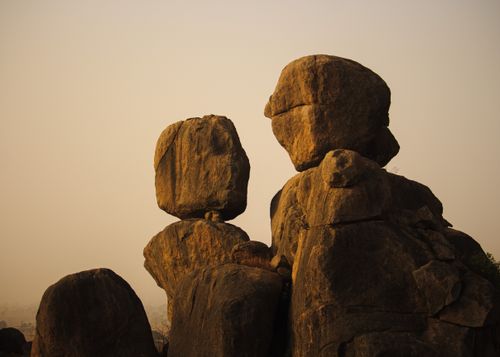 Free Sunset view of stunning natural balancing rock formations with warm golden light. Stock Photo