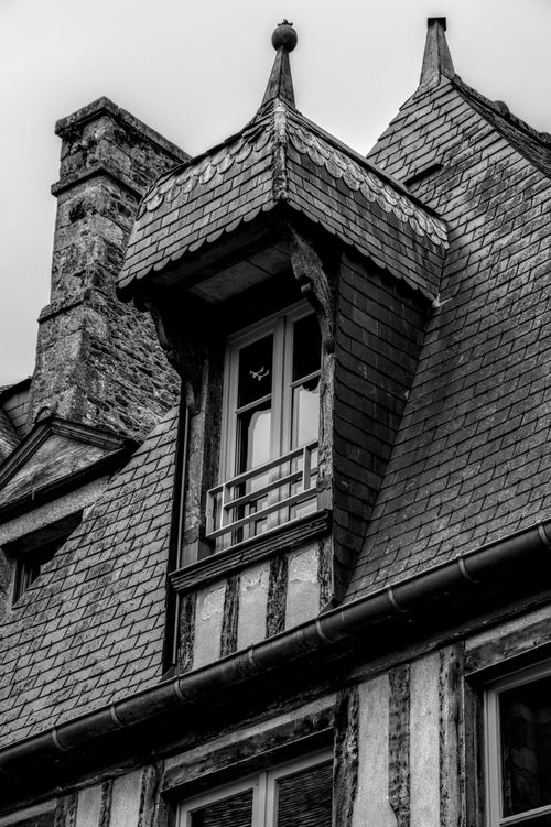 Free Black and white photo of a historic building in Brittany, France with Gothic architectural elements. Stock Photo