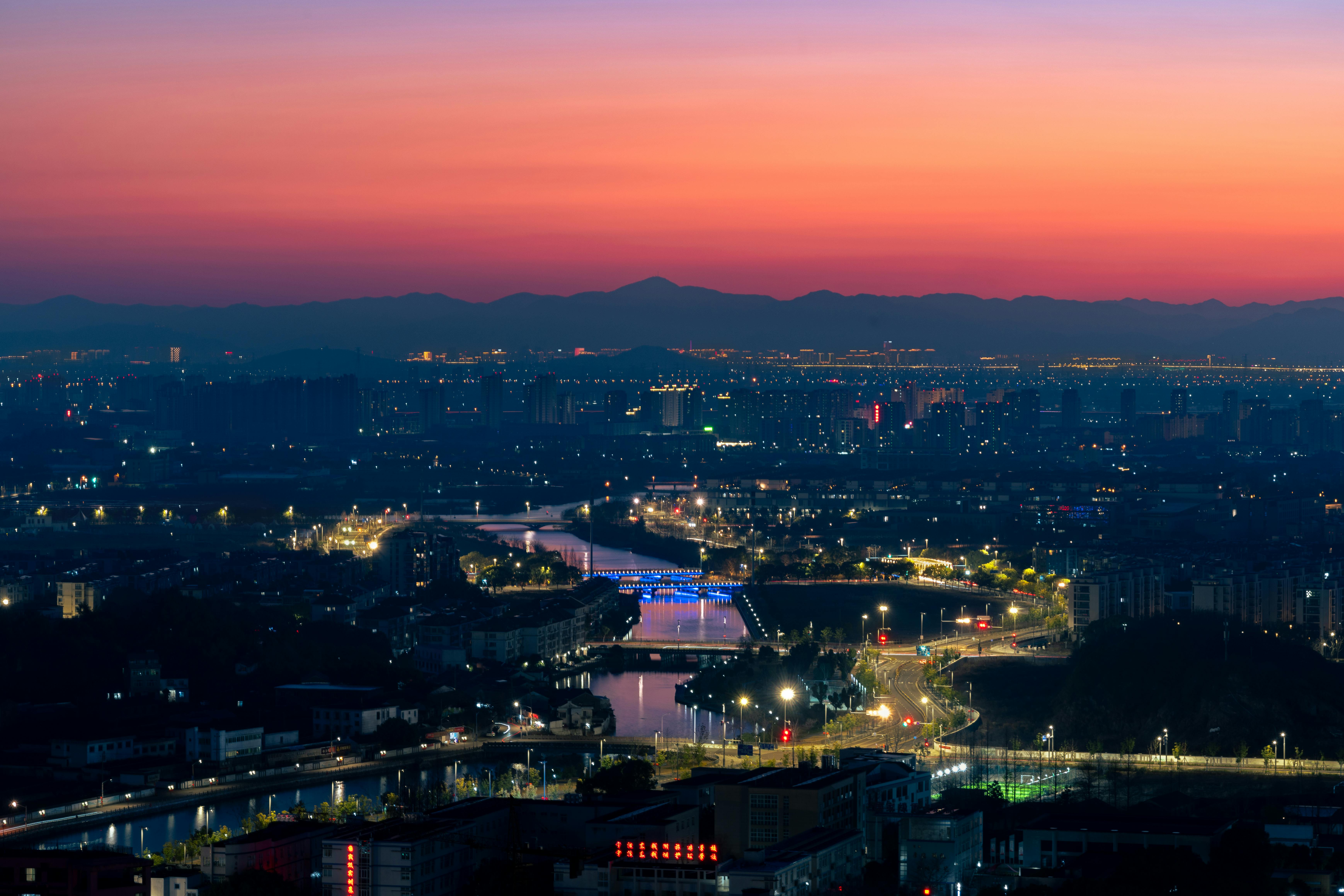 Vibrant Cityscape at Twilight with Glowing Skyline