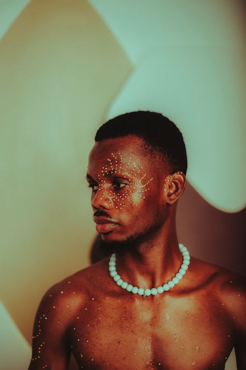 Artistic Portrait of a Man with Face Paint · Free Stock Photo
