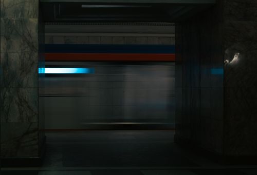 Free Abstract image capturing motion blur of a train in a dimly lit Moscow metro station hallway. Stock Photo