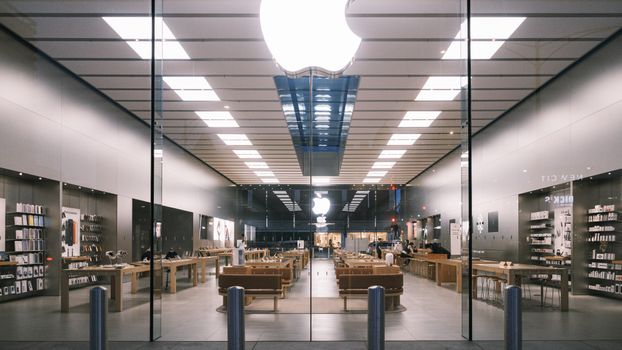 Explore the minimalist design of a modern tech store interior, showcasing a bright, elegant layout.