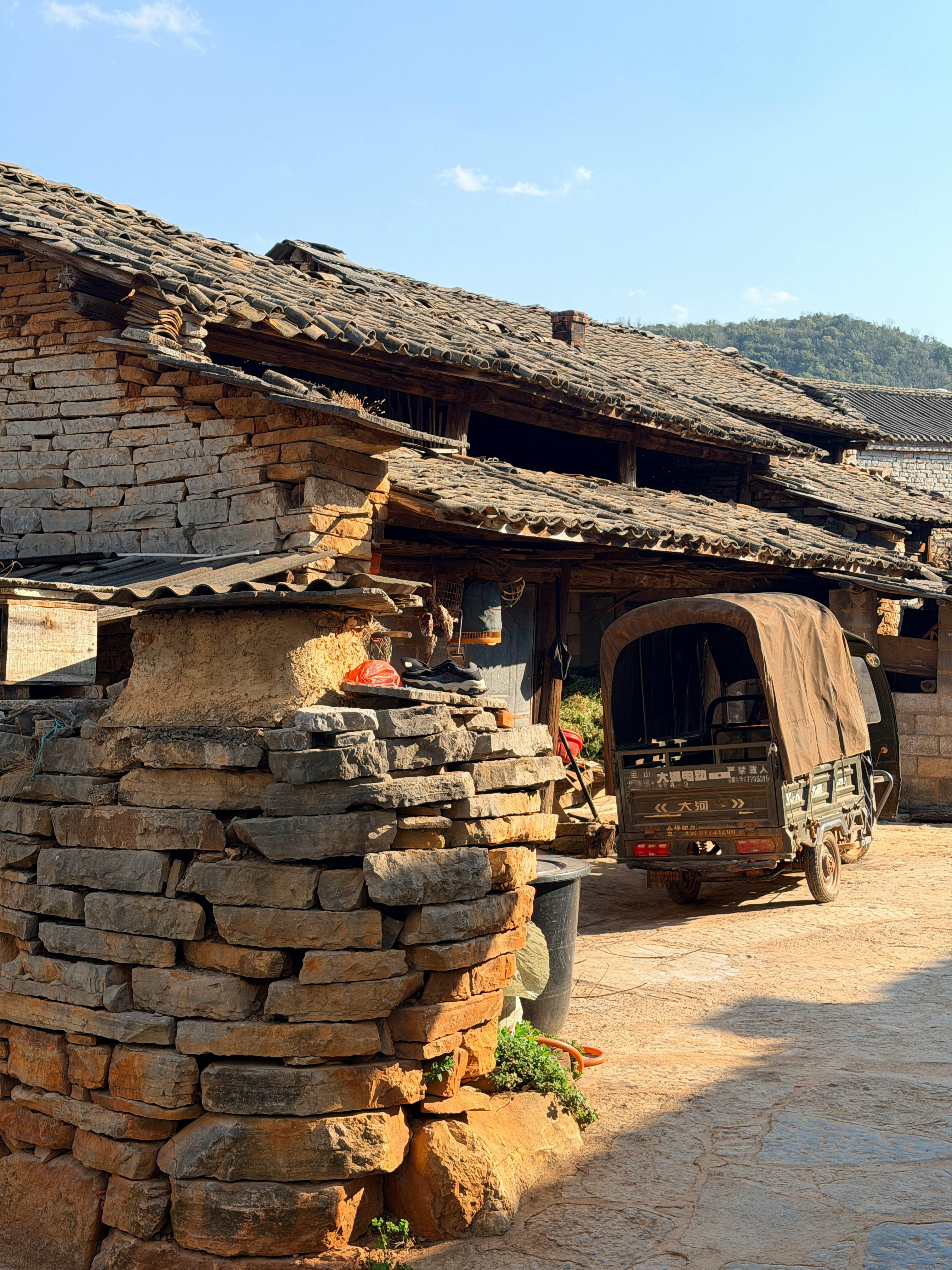 Rustic Stone House with Truck in Countryside