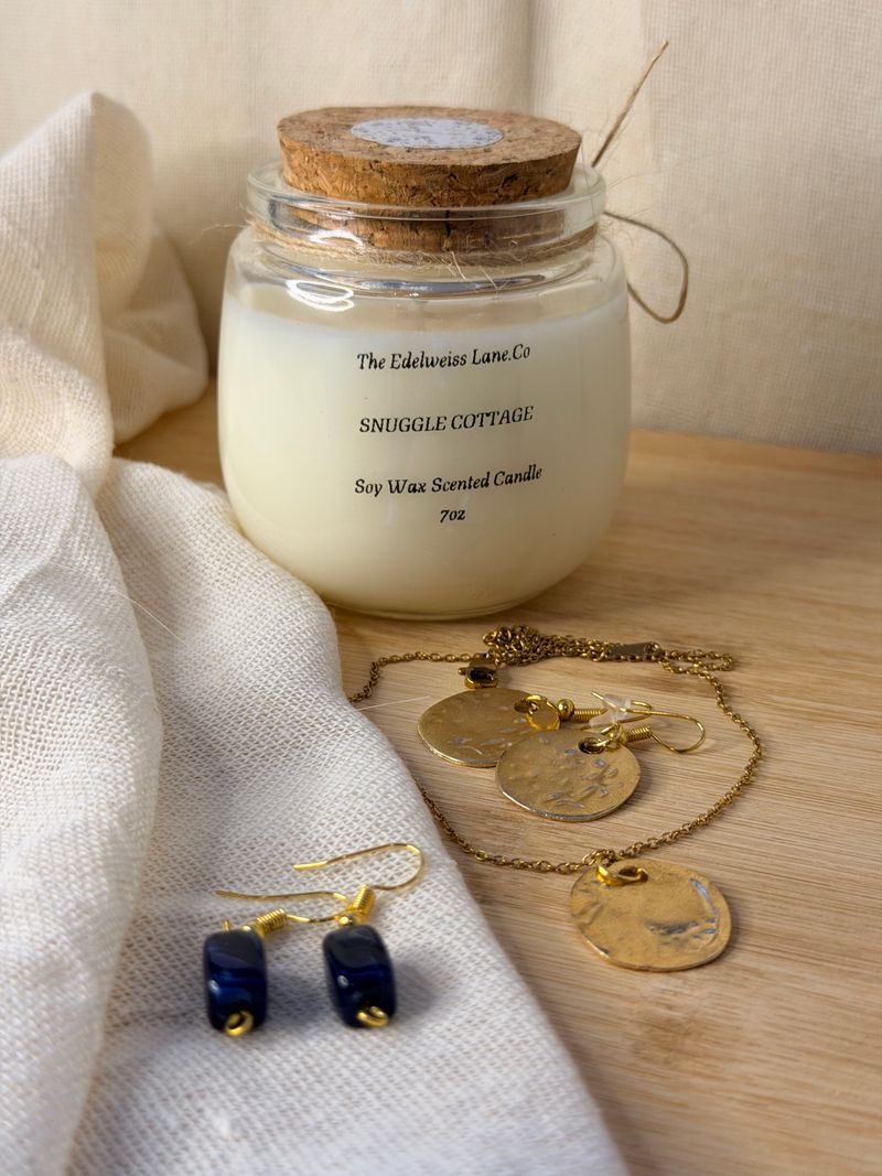Amber Glow Candle Set in gold vessels on wood