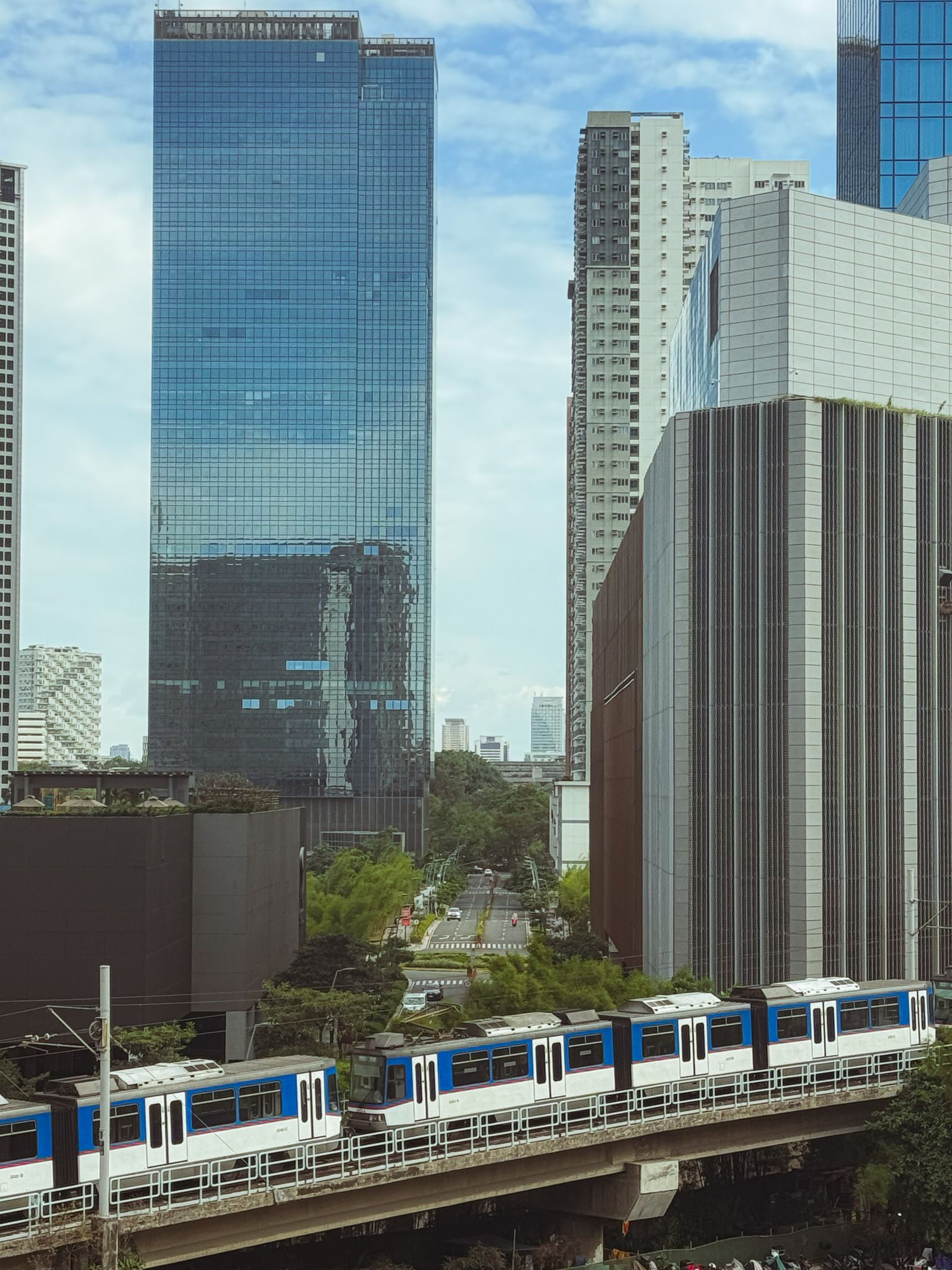 Modern Manila skyline and urban railway in the Philippines