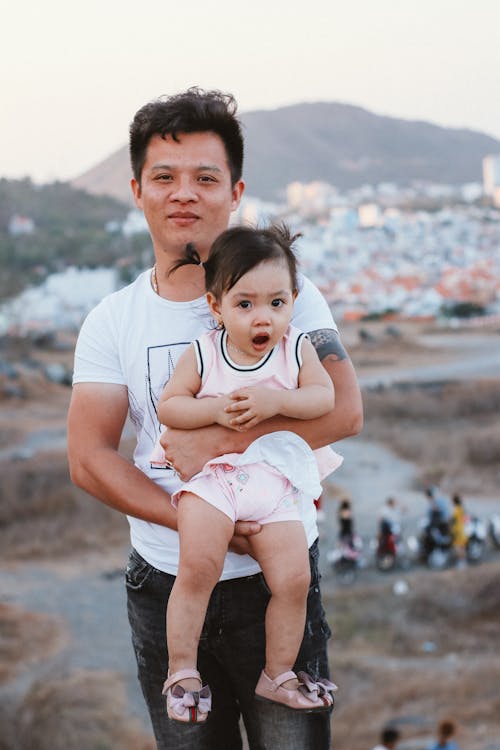 Free Dad Holding a Little Girl Stock Photo