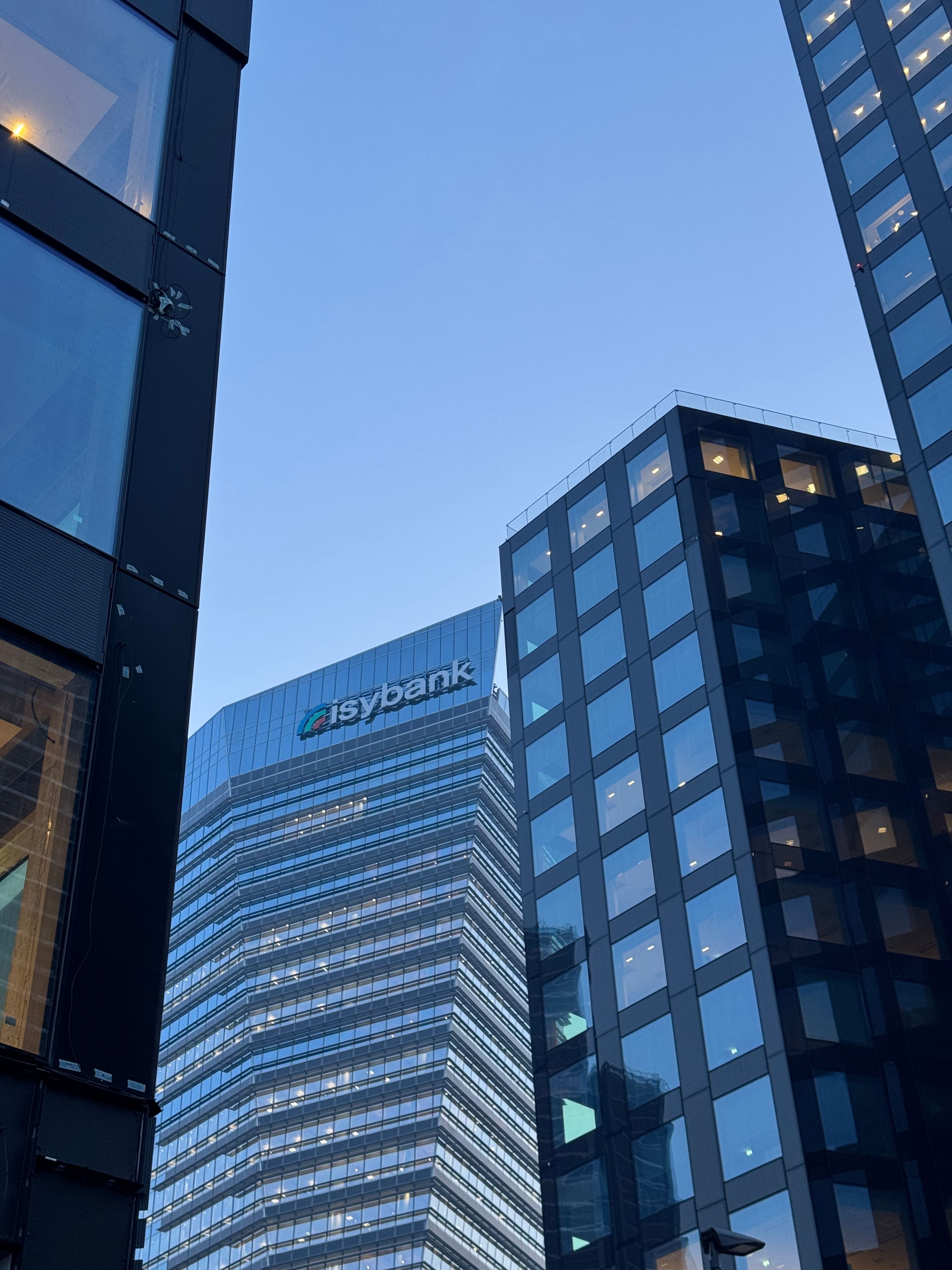 View of sleek glass skyscrapers including the Isybank building in Milan, Italy.