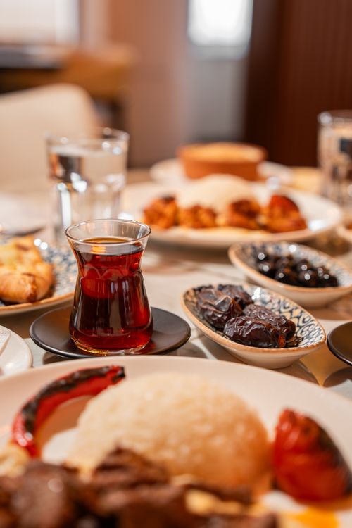 Free A variety of Turkish breakfast dishes with a glass of tea, showcasing regional culinary culture in Ünye, Ordu. Stock Photo