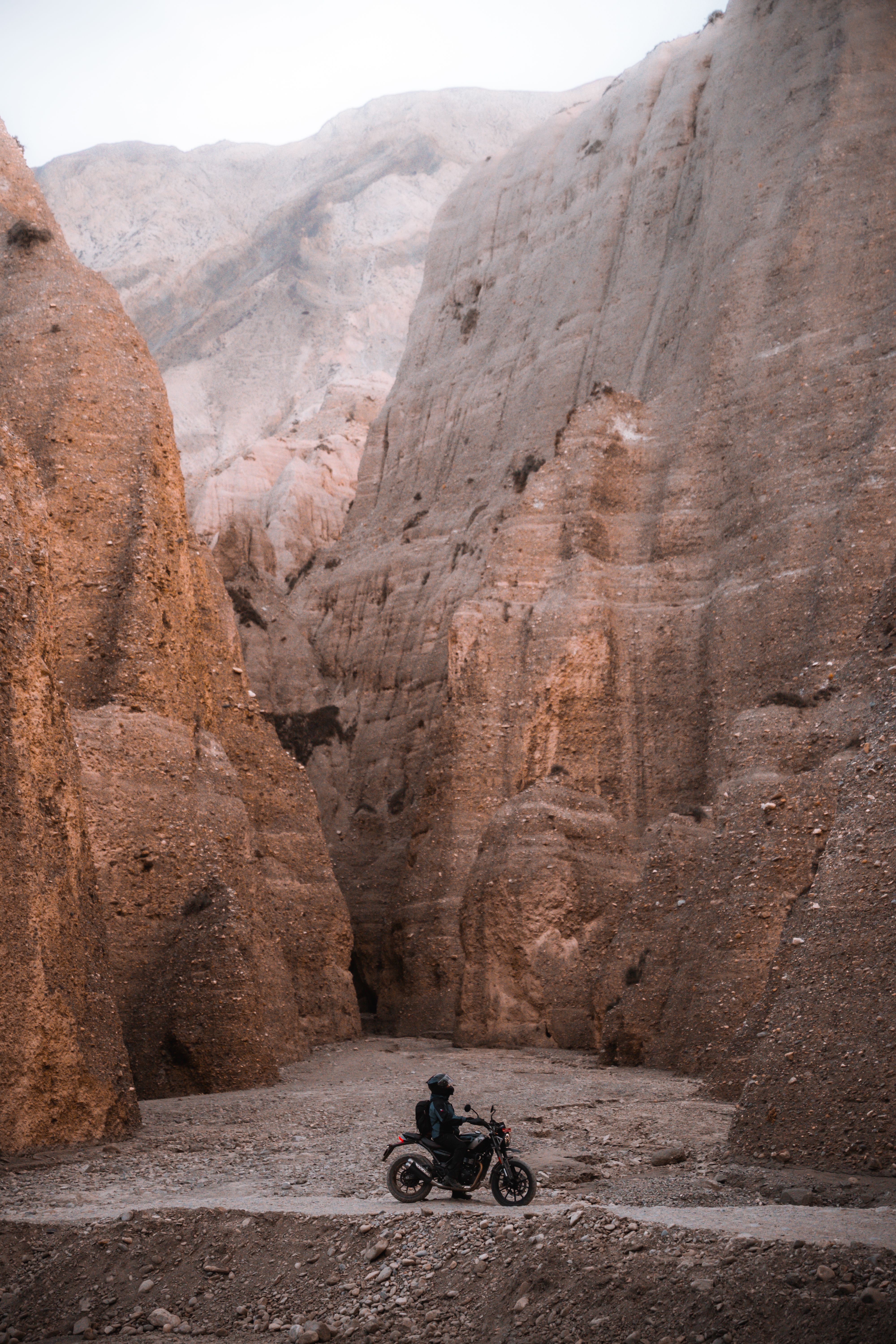 Motorcyclist Riding Through Gandaki Province Cliffs · Free Stock Photo