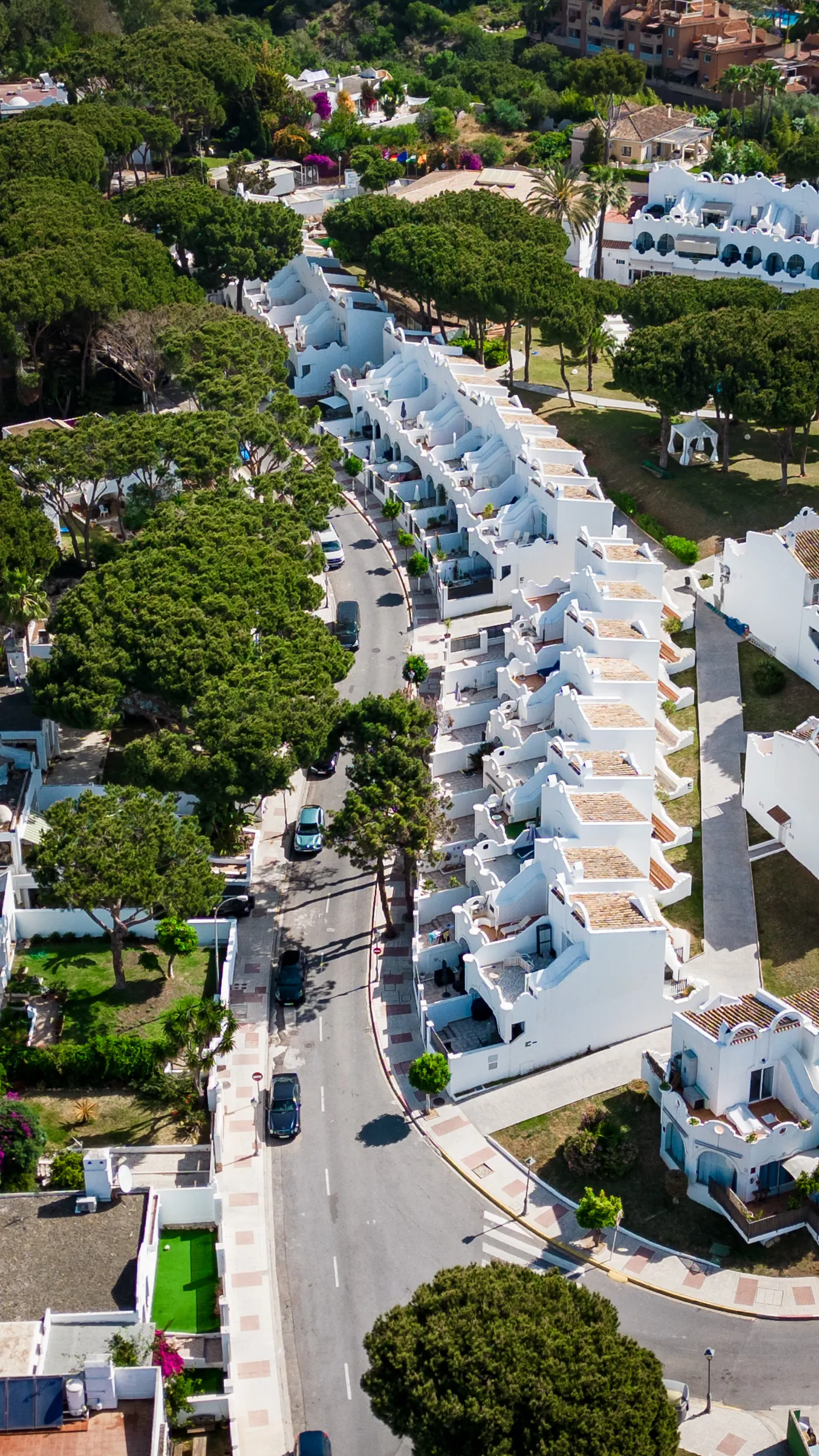 White townhouses and shared landscaped surroundings in Marbella