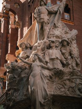 Detailed stone sculpture on an architectural facade, capturing historical and cultural artistry.