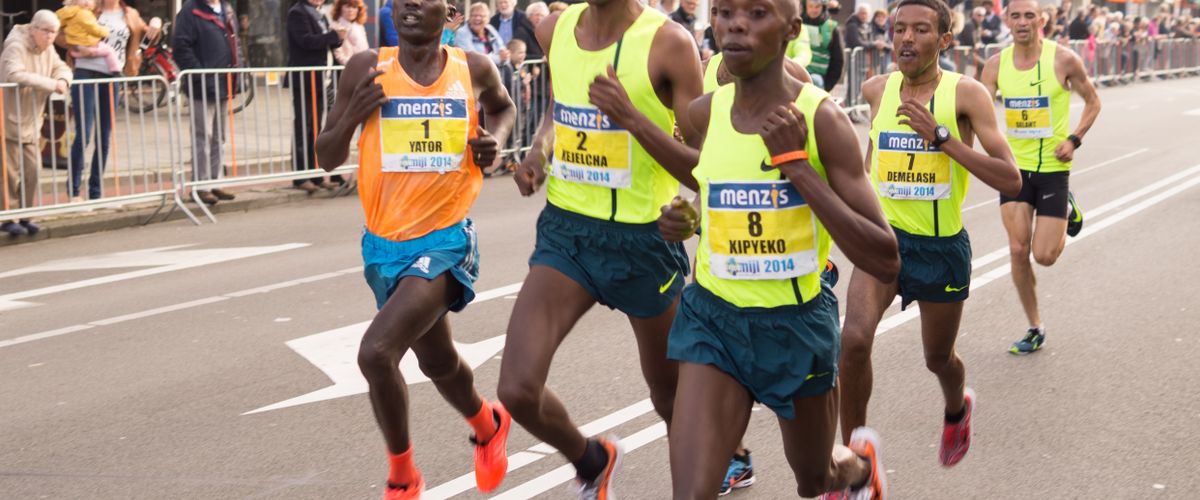 Group of people running together in a park