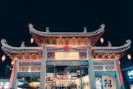 Traditional Chinese Street Gate Illuminated at Night