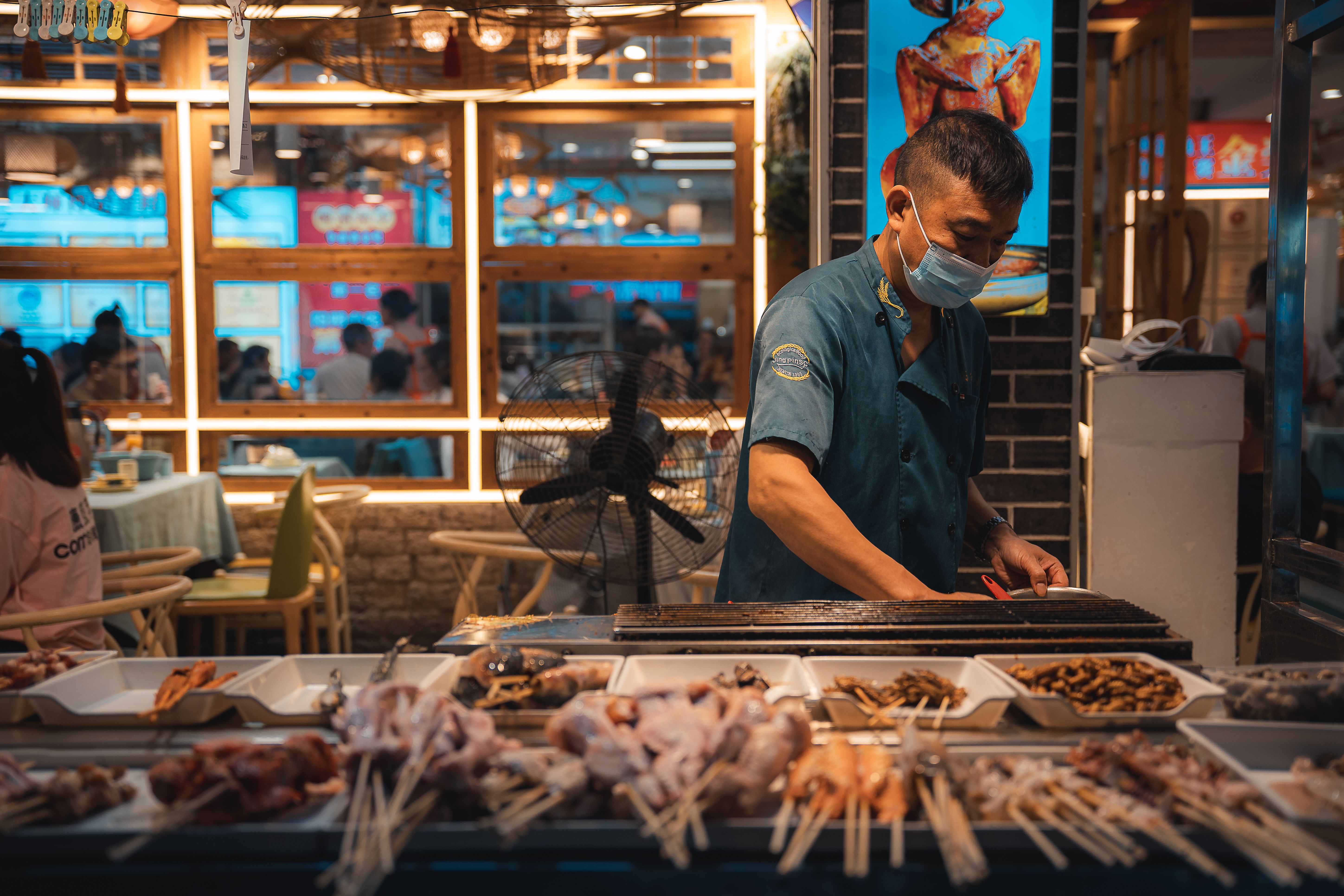 Local street food preparation at a popular stall in Guilin