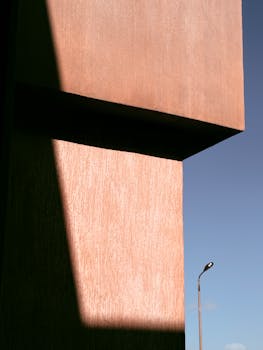 Minimalist architectural detail in El Sheikh Zayed City, Egypt with dramatic lighting.
