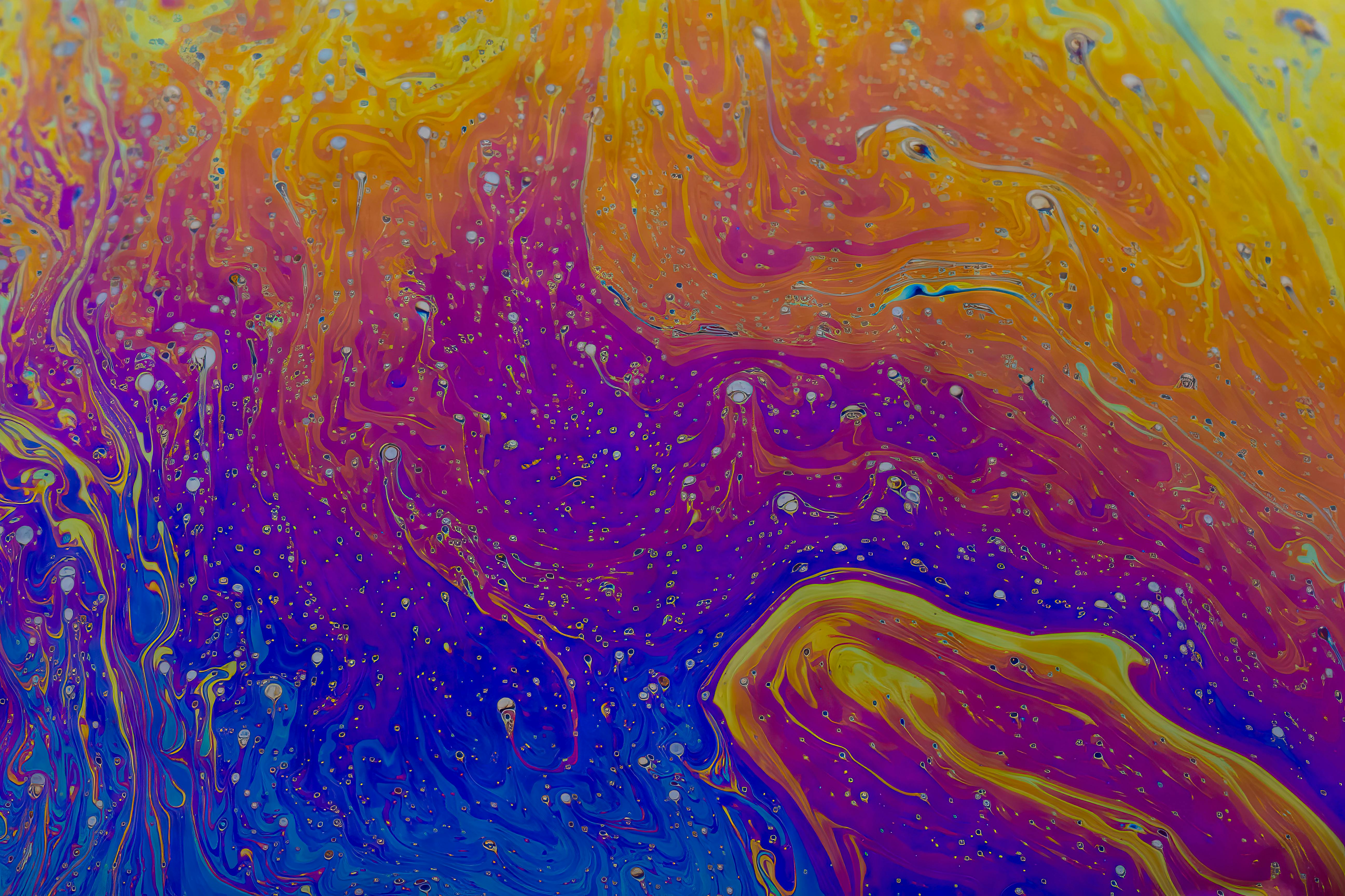 Free Dynamic abstract image featuring vibrant swirling colors and psychedelic texture. Stock Photo