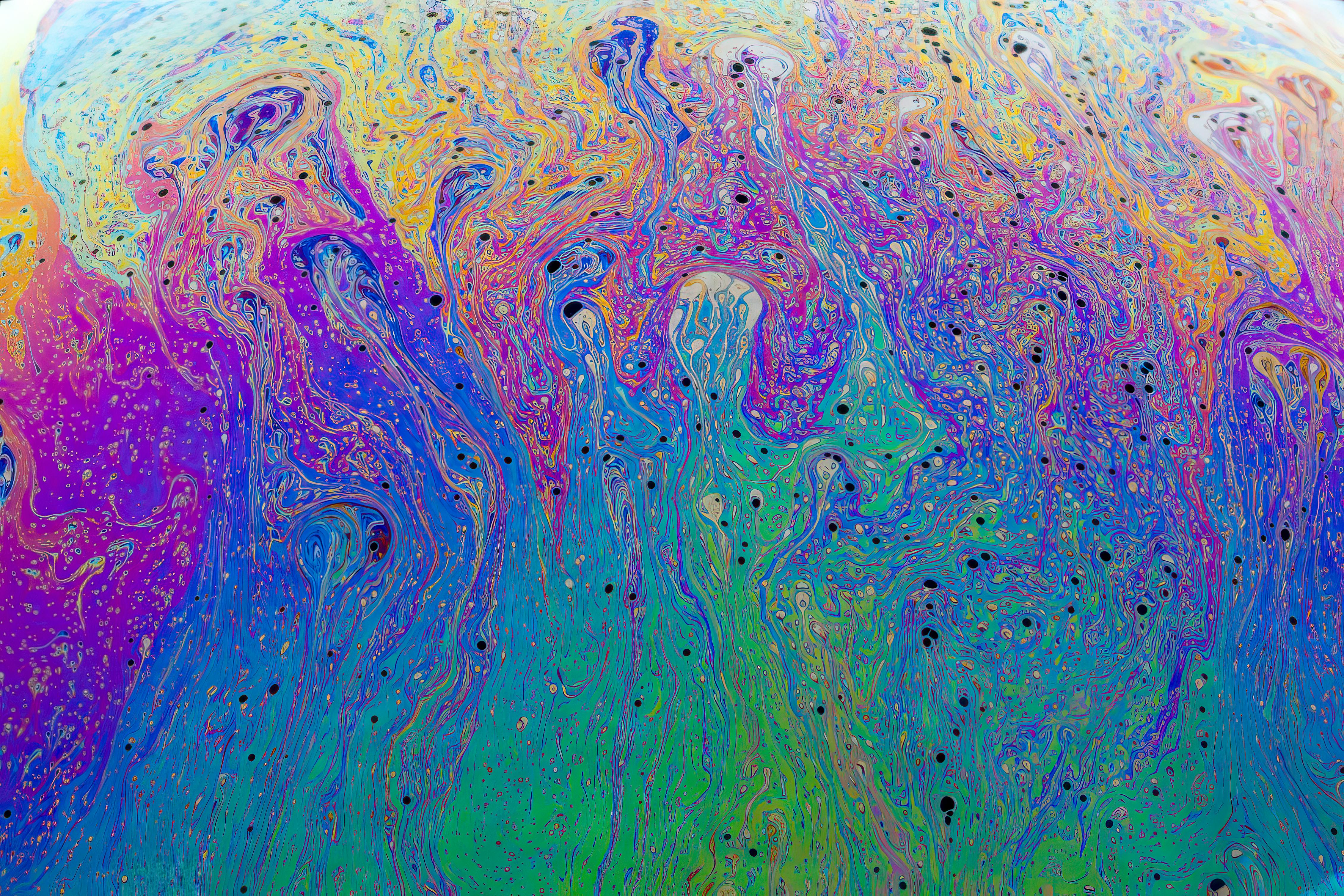 Free A vibrant and colorful fluid art piece featuring multicolored psychedelic patterns and swirling textures. Stock Photo