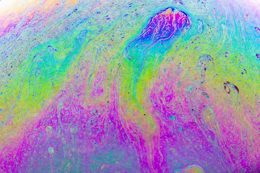 Explore vibrant fluid patterns resembling liquid art, showcasing a psychedelic and artistic texture.