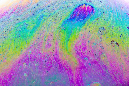 Free Explore vibrant fluid patterns resembling liquid art, showcasing a psychedelic and artistic texture. Stock Photo