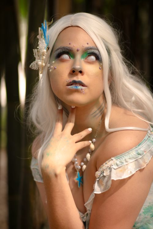 Free Enchanting portrait of a woman with mermaid-inspired costume and makeup taken outdoors in Mexico City park. Stock Photo