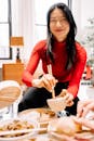 Asian Woman Enjoying Dim Sum in Cozy Setting