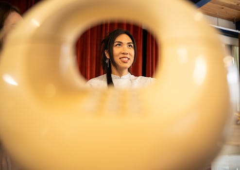 Artistic portrait view through a vintage phone, capturing joyful expression.