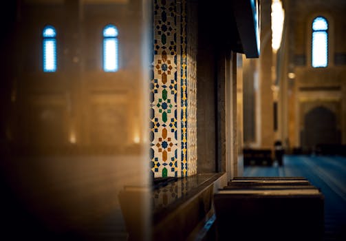 Beautiful interior of a mosque in Kuwait City showcasing intricate mosaic tile work and architectural designs.