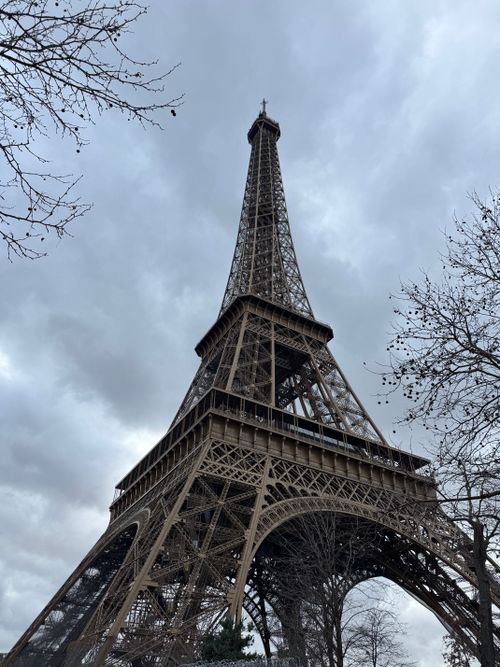 Free Striking view of the Eiffel Tower with overcast clouds in Paris, France. Stock Photo