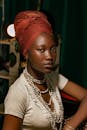 Elegant Portrait of Woman with Headwrap and Beads