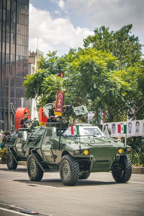 Free Armored vehicles in a Mexican military parade, showcasing national pride in Mexico City. Stock Photo