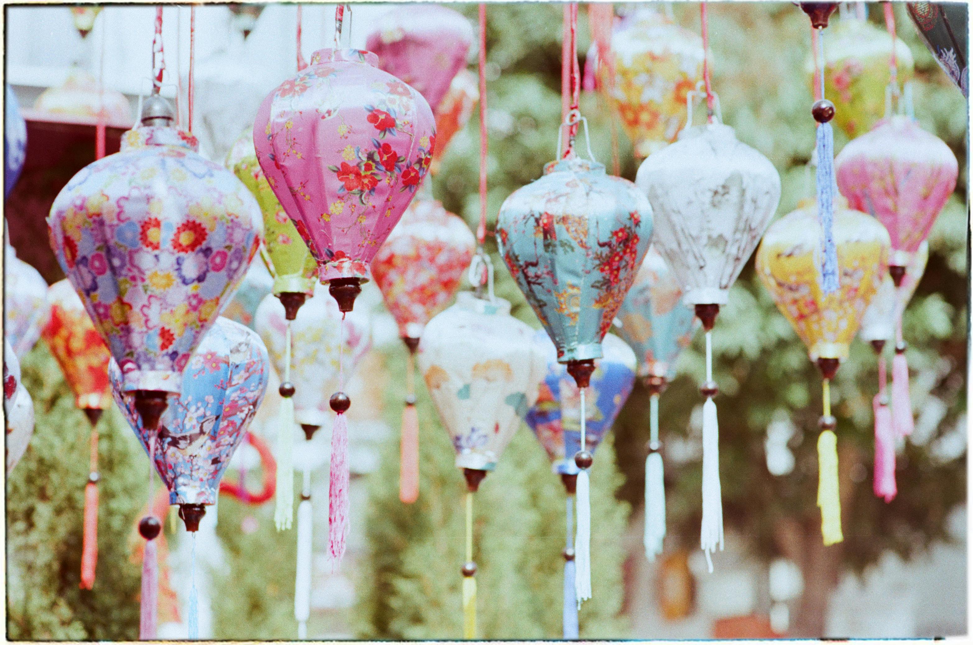 Vibrant traditional Vietnamese lanterns hanging outdoors in Hanoi, capturing cultural elegance and beauty.