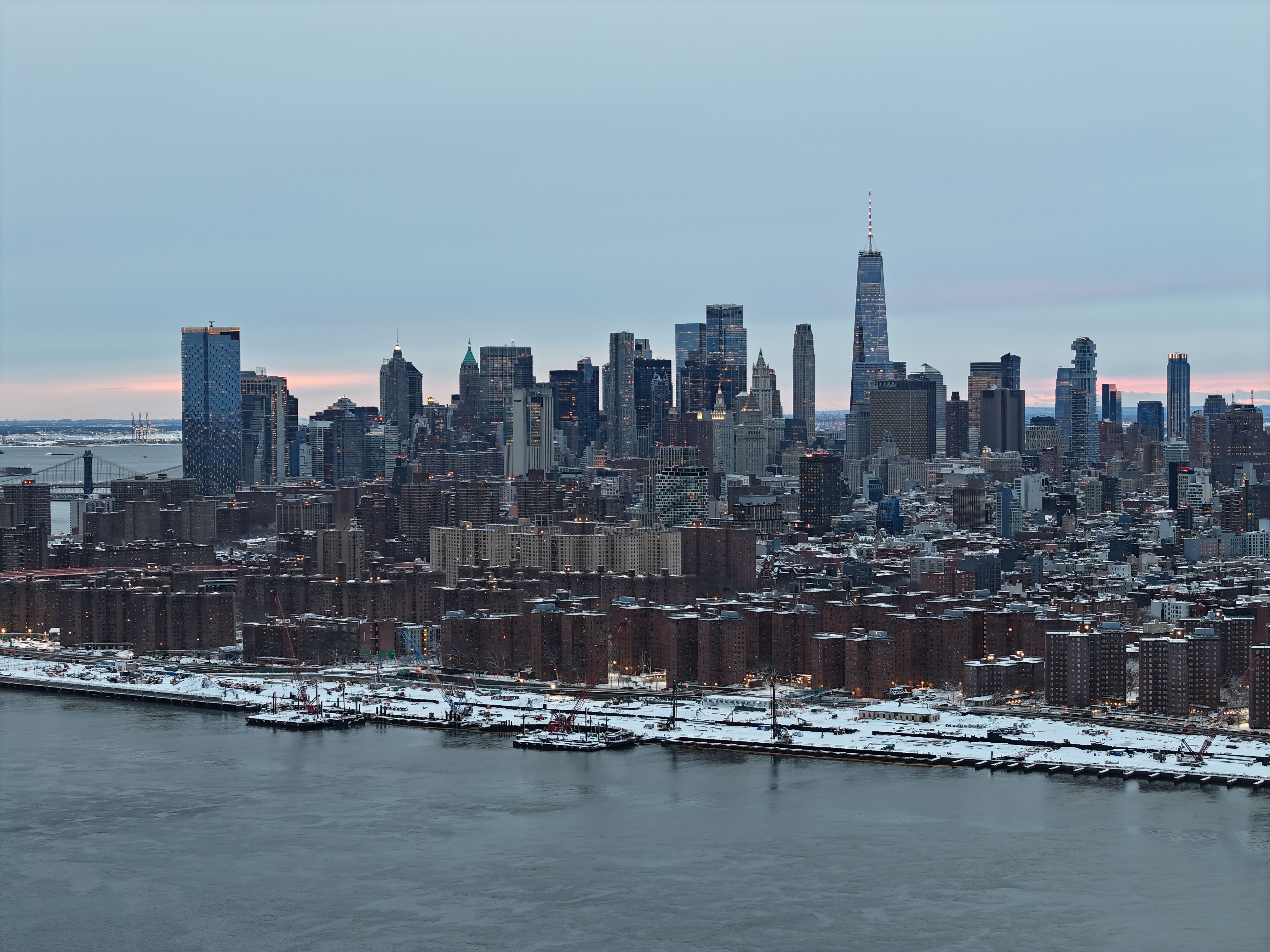 Private Romantic NYC Helicopter Scenic Charter with Champagne - A stunning aerial shot of New York City skyline covered in snow during the day.