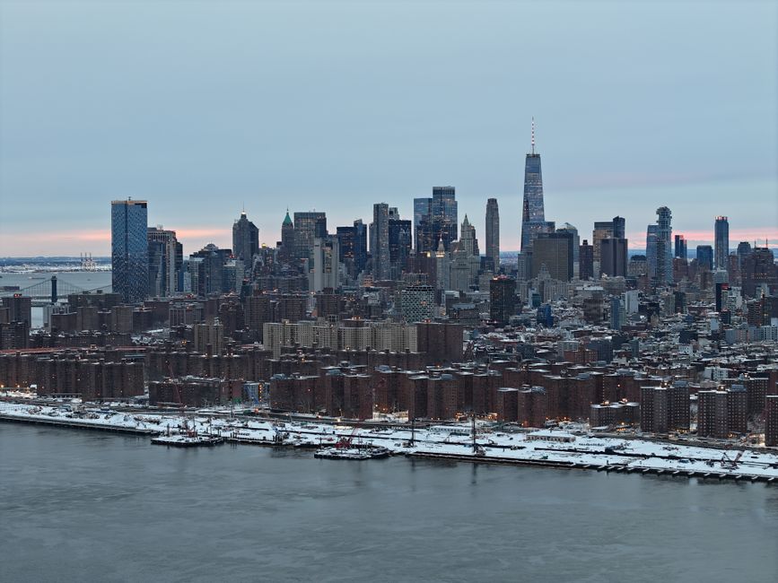 Private Romantic NYC Helicopter Scenic Charter with Champagne - A stunning aerial shot of New York City skyline covered in snow during the day.