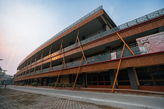 Contemporary architecture of a school building in Delhi, India, captured at dusk with ornate designs.