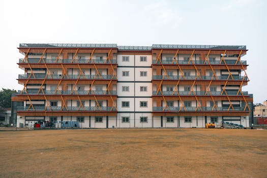 Front view of a modern apartment building in Delhi, India, showcasing unique architectural design.