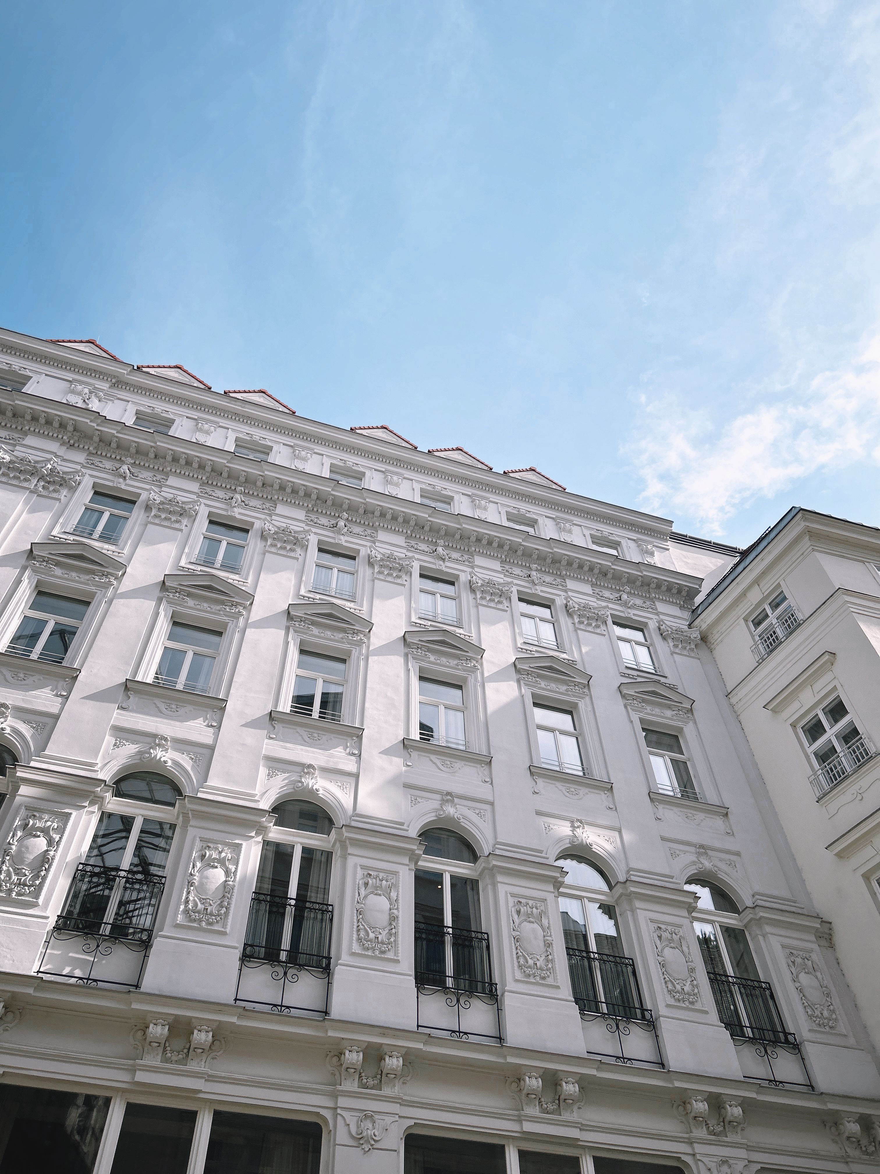 Elegant Classical European Building Under Blue Sky · Free Stock Photo