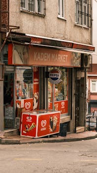 A quaint market in Istanbul with vibrant signage and street view.