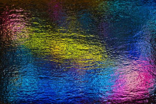 Bold abstract image with vibrant textured colors in a ripple effect.
