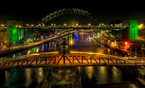 Free Stunning night scene of Tyne Bridge over the River Tyne with vibrant city lights. Stock Photo