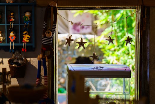 Charming rustic window with starfish ornaments and playful wooden toys inside a cozy room.