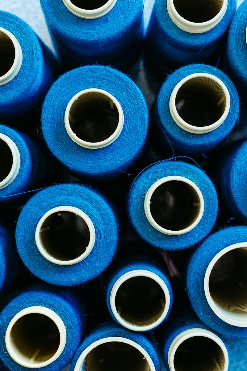 Blue polyester filament yarn spools