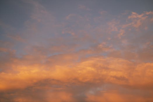 Golden sunset clouds creating a vibrant sky in Minas Gerais, Brasil.