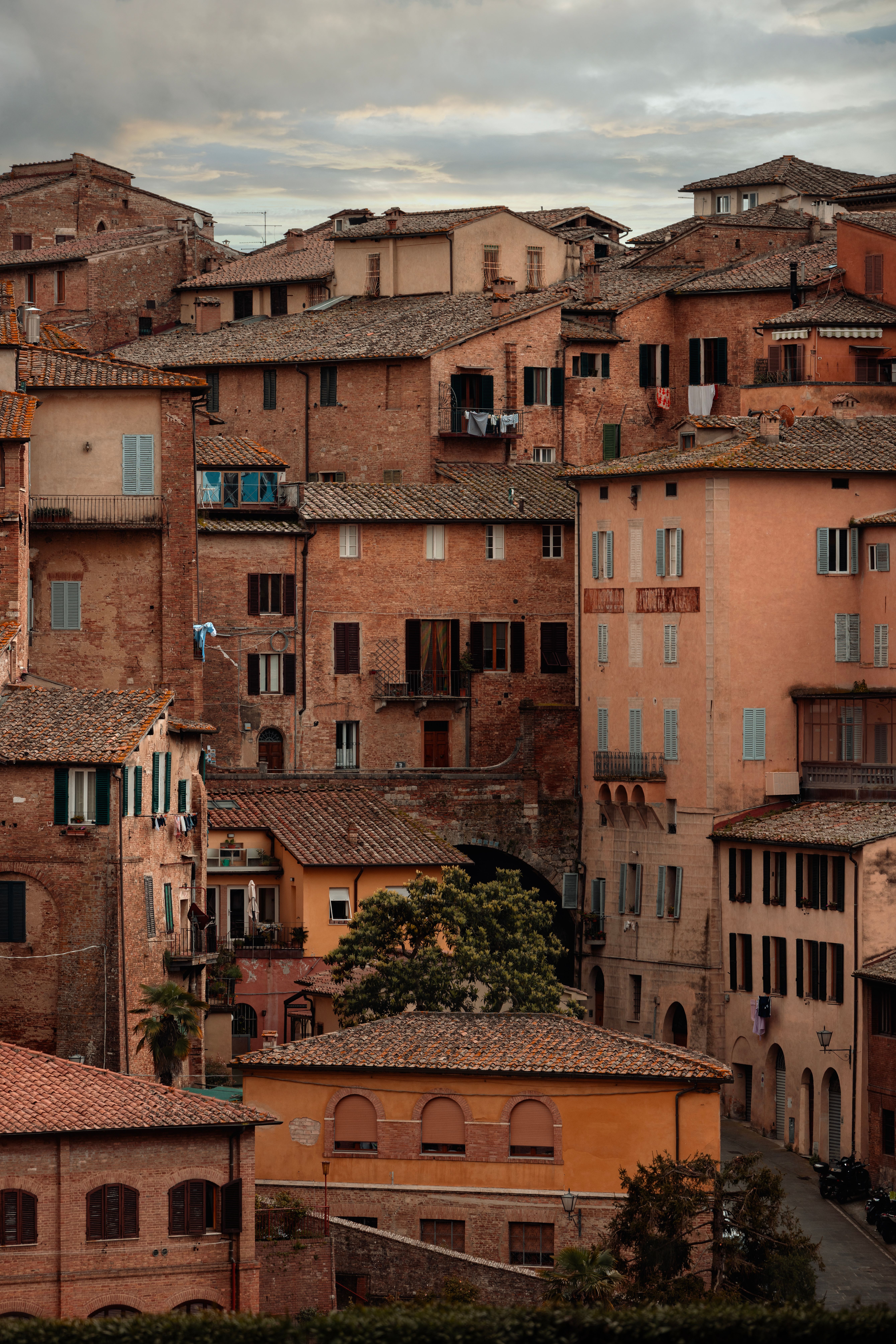 Rustic Italian buildings in Siena creating a quaint street view.