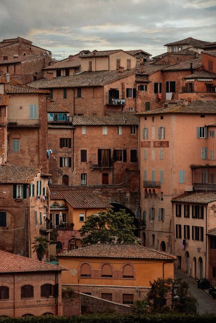 Rustic Italian buildings in Siena creating a quaint street view.
