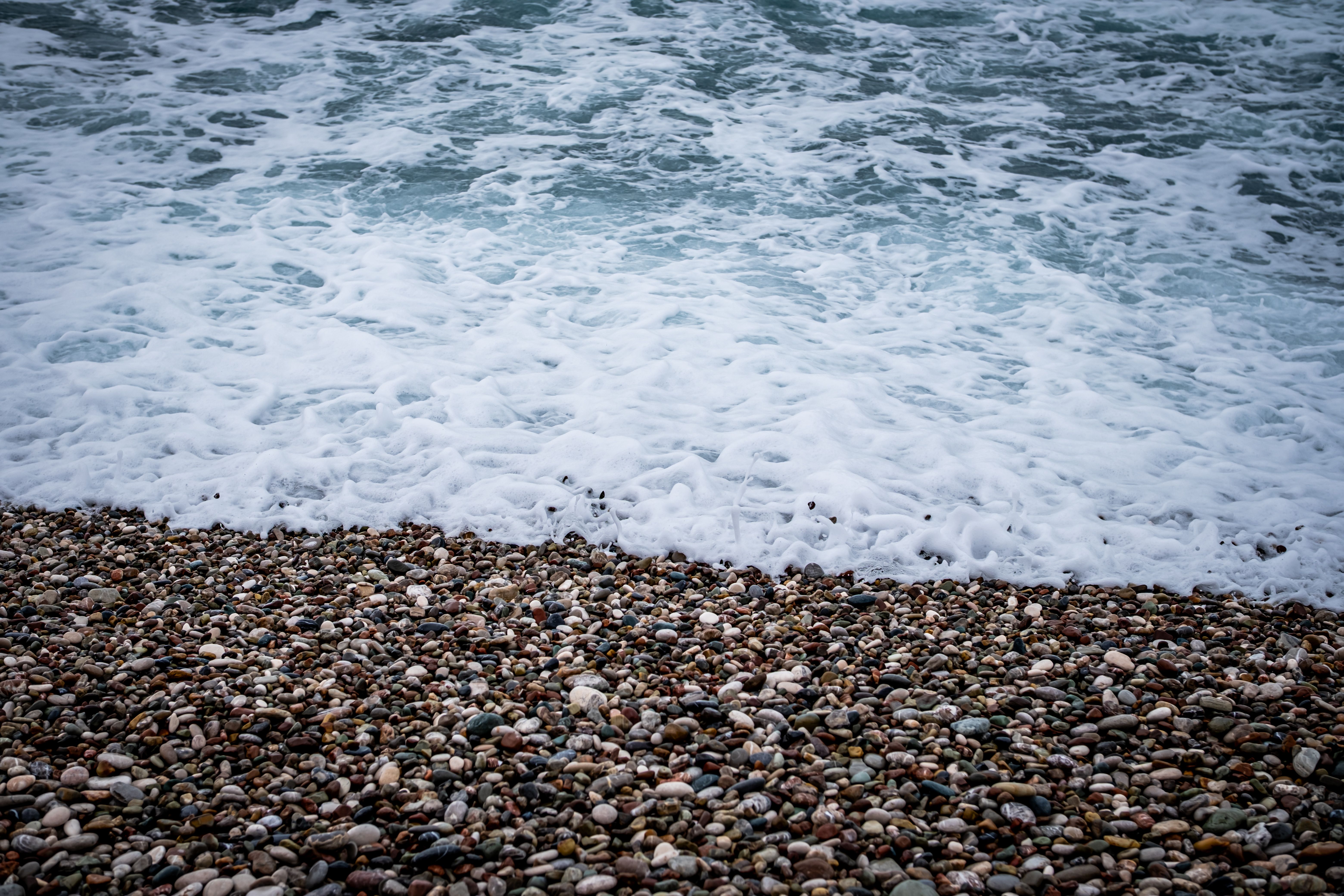 Pebble Beach Shoreline with Ocean Waves · Free Stock Photo