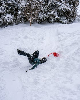 Joyful moment of a person playing in the snow in Cambridge, Massachusetts.