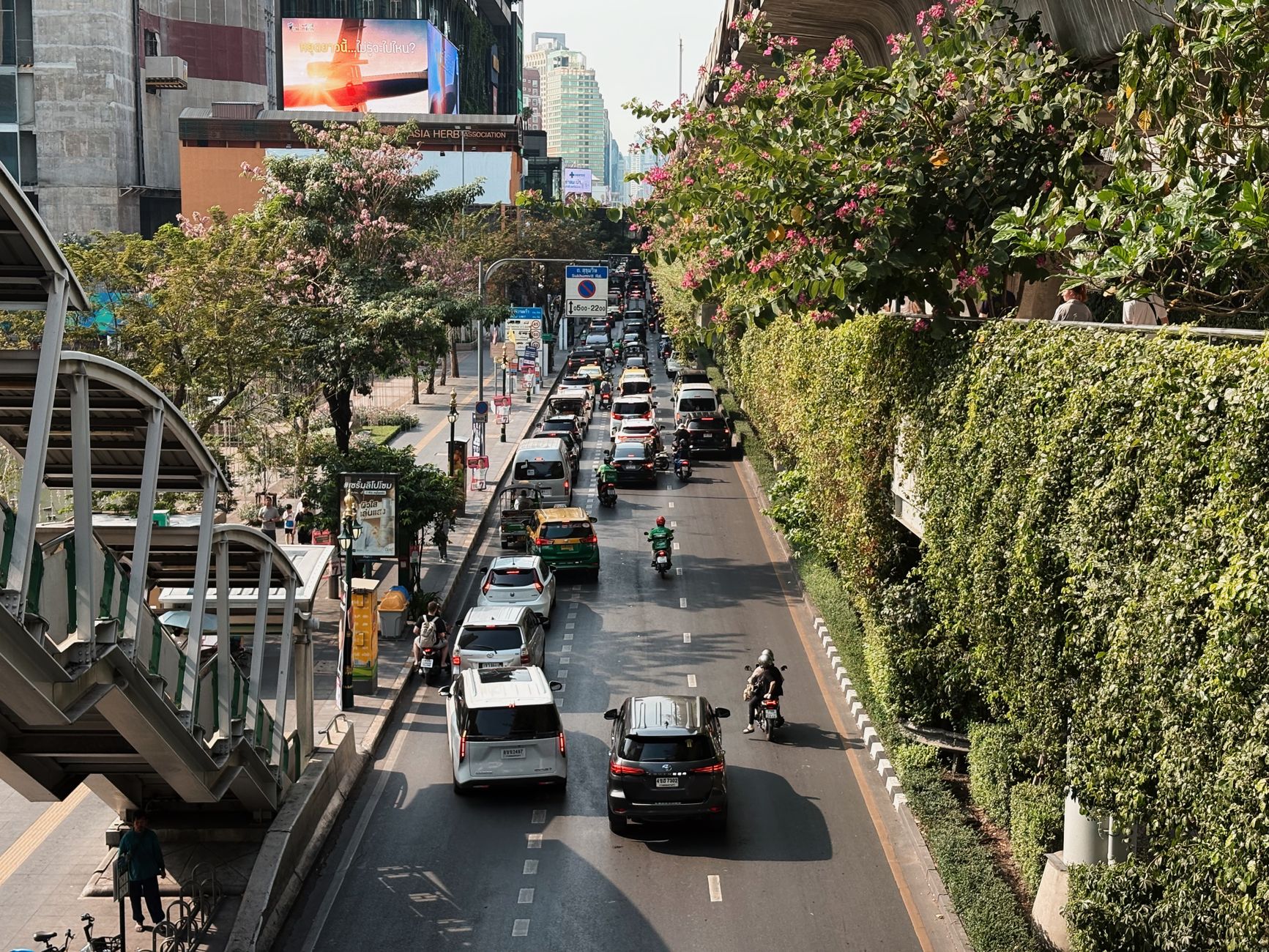 BTS Skytrain running above Sukhumvit Road in Bangkok.