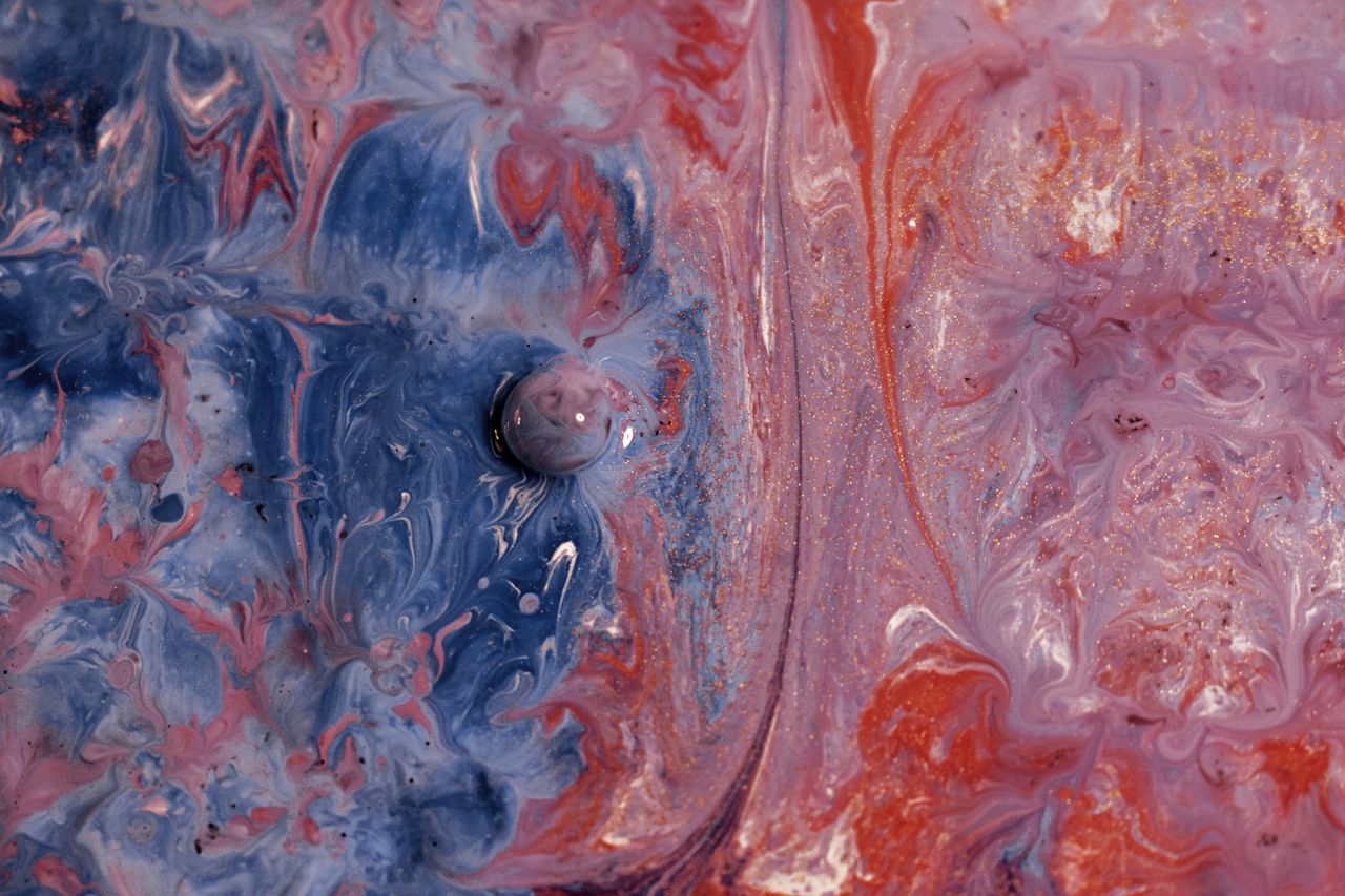 vibrant abstract fluid art with swirling blue and pink colors