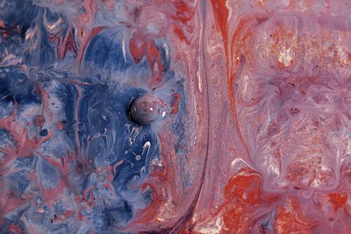 Free Vibrant abstract fluid art with swirling blue and pink colors. Stock Photo