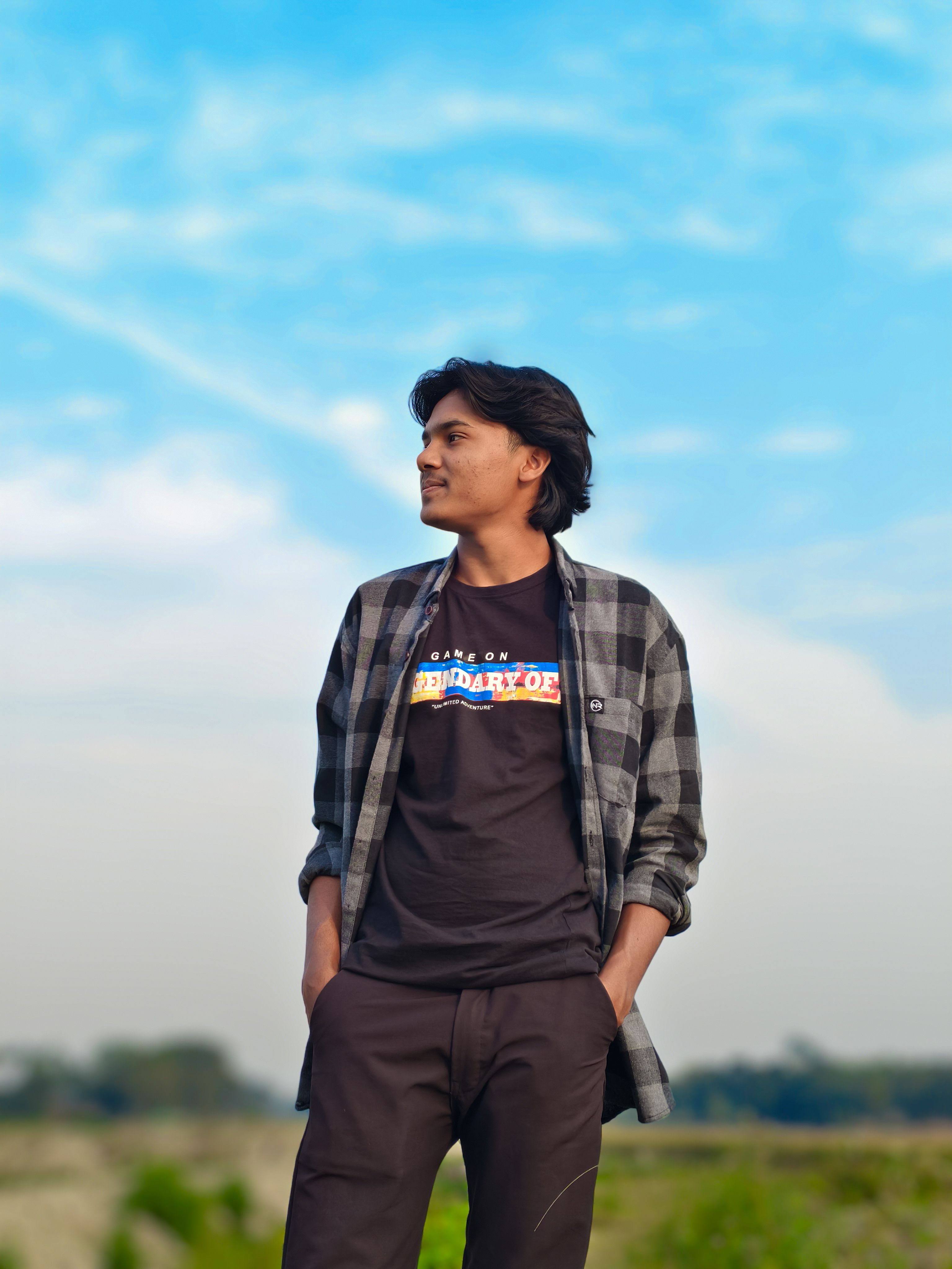 Young Man Outdoors under Clear Blue Sky · Free Stock Photo